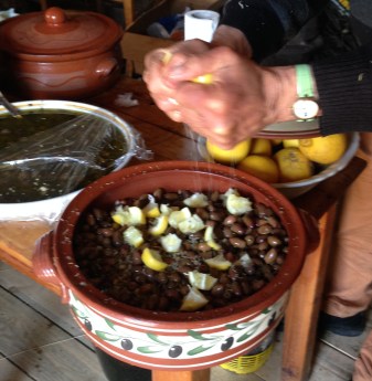 Green olives with lemon, olive oil, and throubi